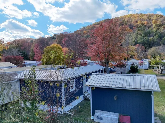a view of balcony with wooden floor and outdoor seating