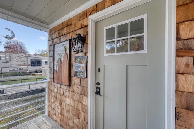 a front view of a house with a large window