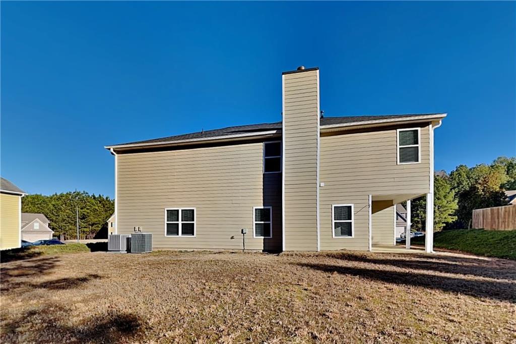 227 Brightondale Boulevard Dallas, GA 30132 - Photo 24 of 26 a front view of a house with a yard