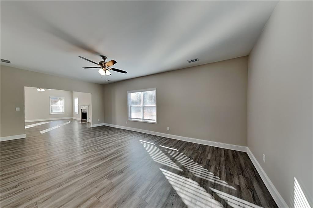 227 Brightondale Boulevard Dallas, GA 30132 - Photo 4 of 26 wooden floor in an empty room with a window