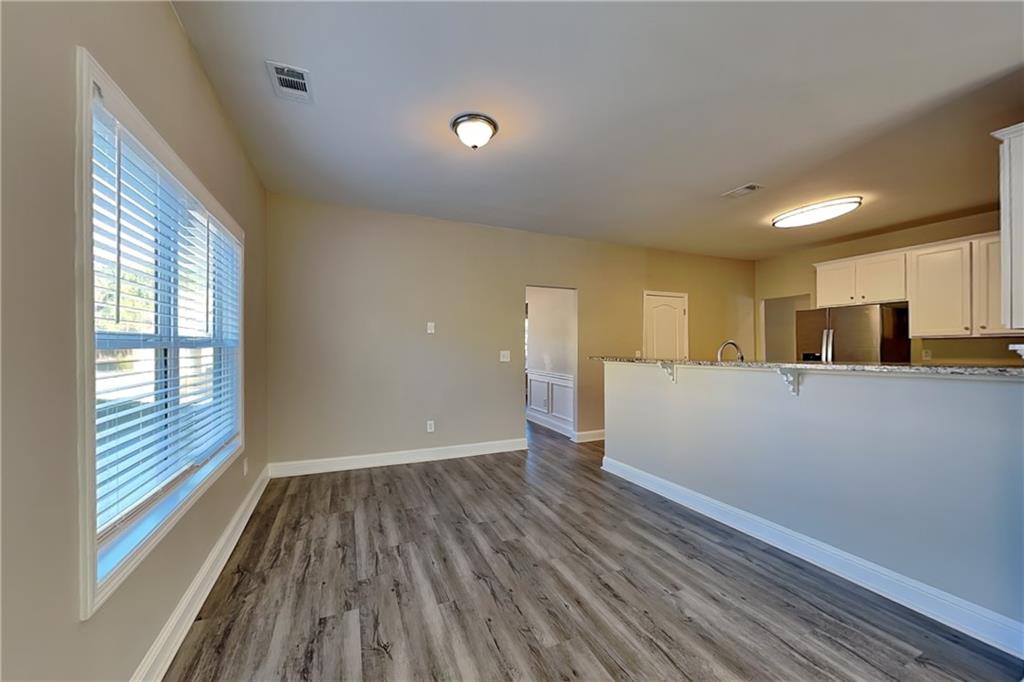 227 Brightondale Boulevard Dallas, GA 30132 - Photo 7 of 26 a view of a kitchen with wooden floor and a sink