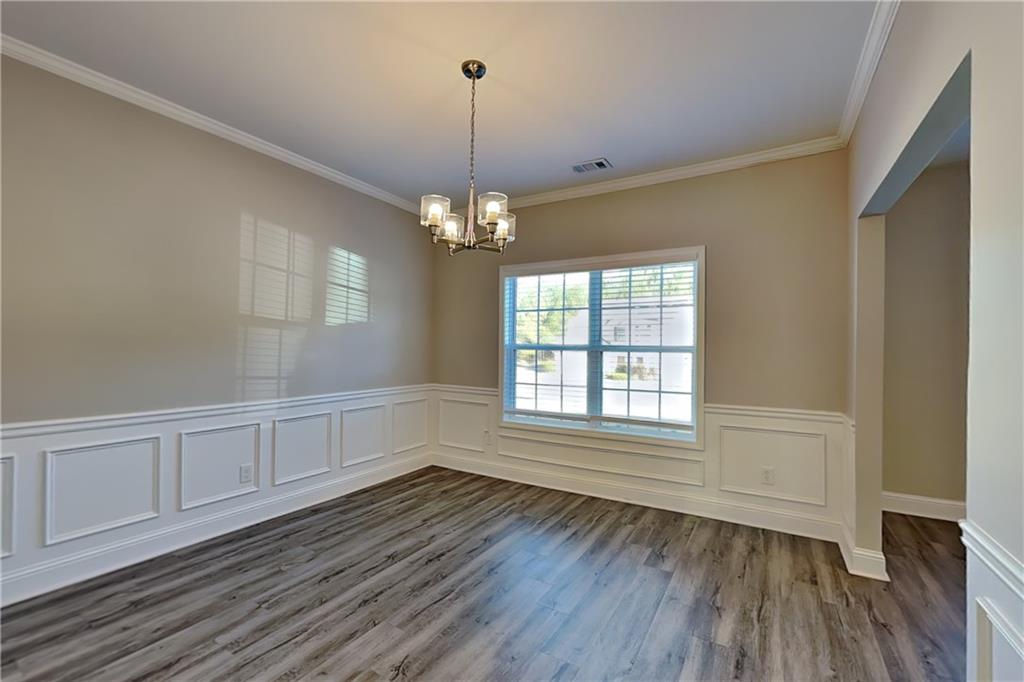 227 Brightondale Boulevard Dallas, GA 30132 - Photo 8 of 26 wooden floor in an empty room with a window