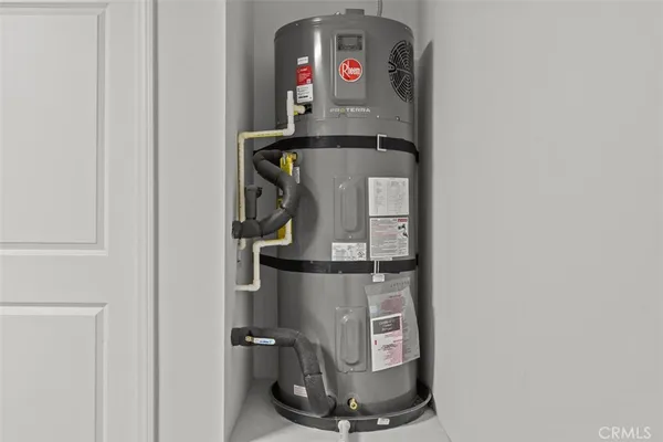 a room with water heater and storage