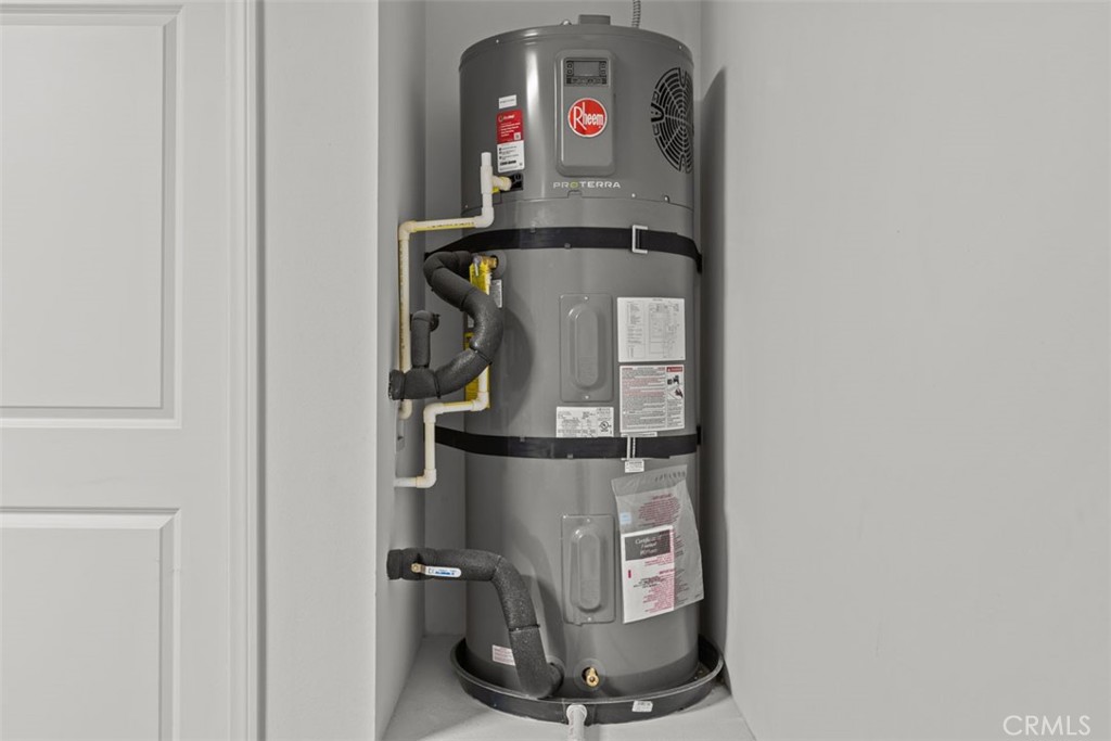 1213 Butterfly Way Banning, CA 92220 - Photo 12 of 18 a room with water heater and storage