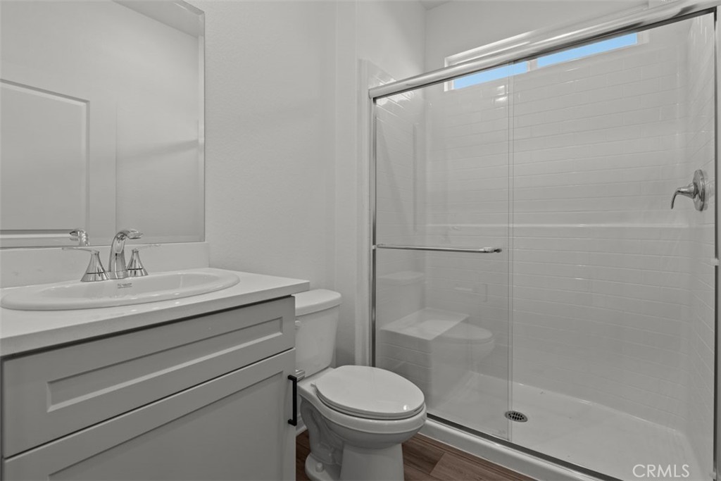 1213 Butterfly Way Banning, CA 92220 - Photo 13 of 18 a bathroom with a sink toilet and shower