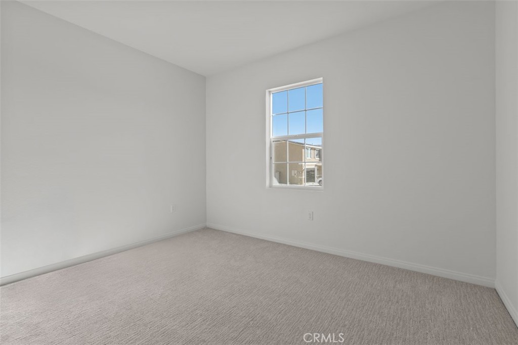 1213 Butterfly Way Banning, CA 92220 - Photo 2 of 18 an empty room with a window