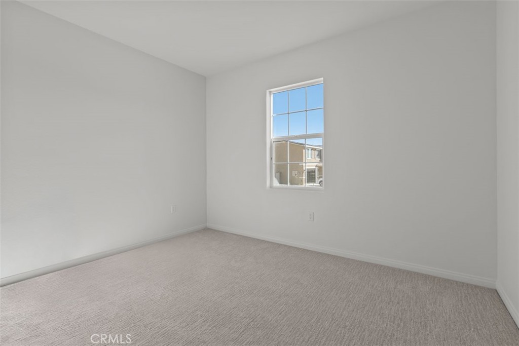 1213 Butterfly Way Banning, CA 92220 - Photo 2 of 18 an empty room with a window
