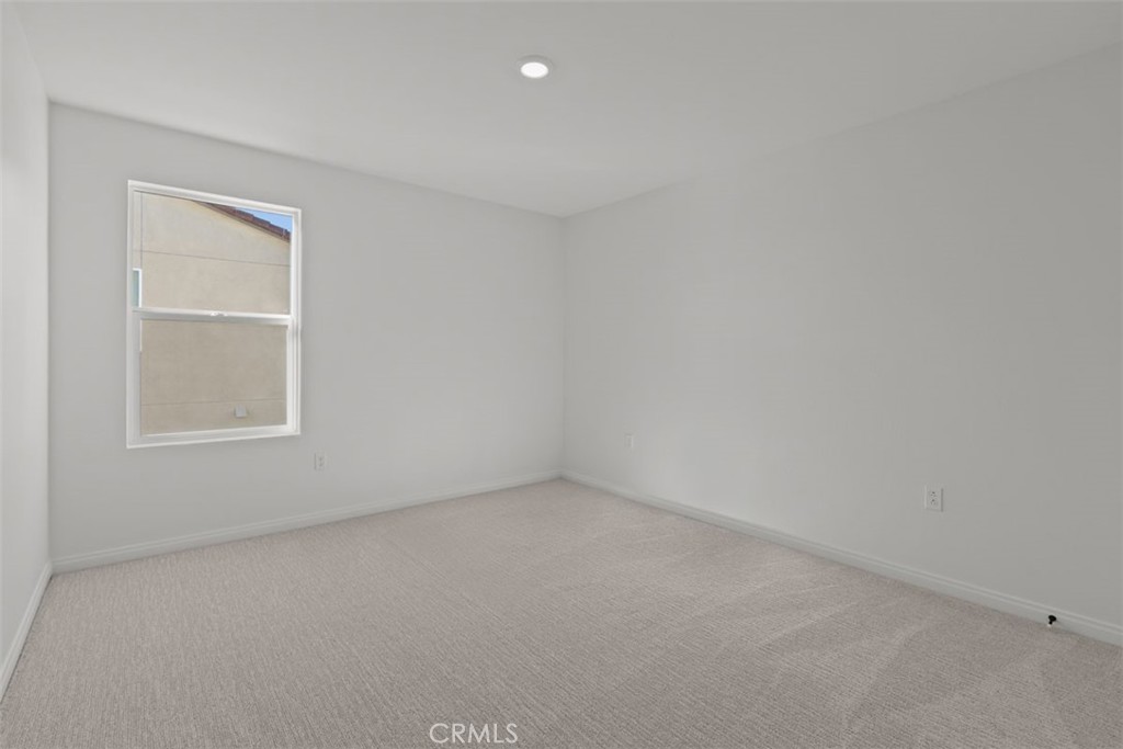 1213 Butterfly Way Banning, CA 92220 - Photo 7 of 18 an empty room with a window