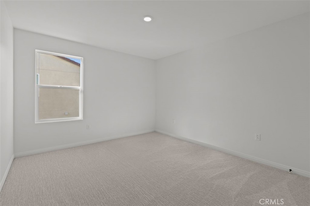 1213 Butterfly Way Banning, CA 92220 - Photo 7 of 18 an empty room with a window