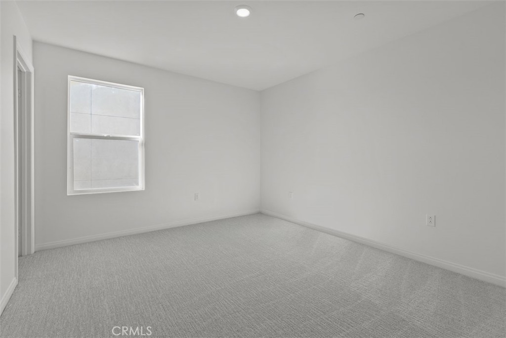 1213 Butterfly Way Banning, CA 92220 - Photo 8 of 18 an empty room with a window