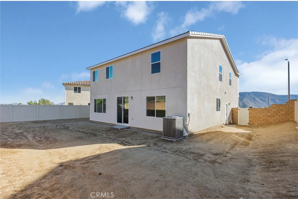 1213 Butterfly Way Banning, CA 92220 - Photo 10 of 18 a view of a house with a backyard