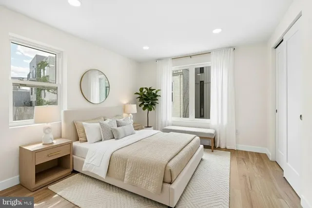 a bedroom with a large bed and a window