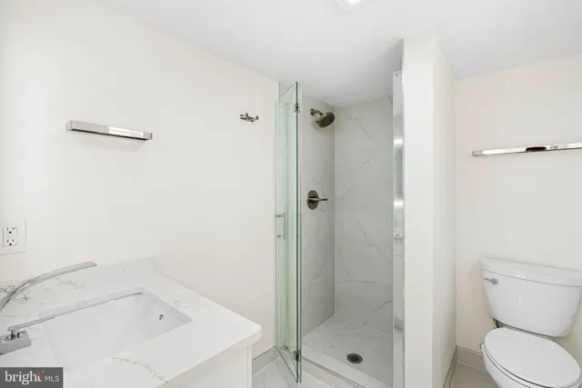 a bathroom with a shower and toilet