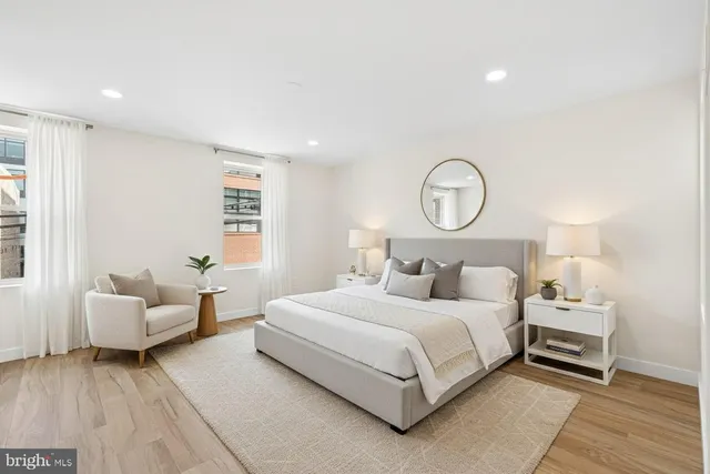 a bedroom with a bed and a couch