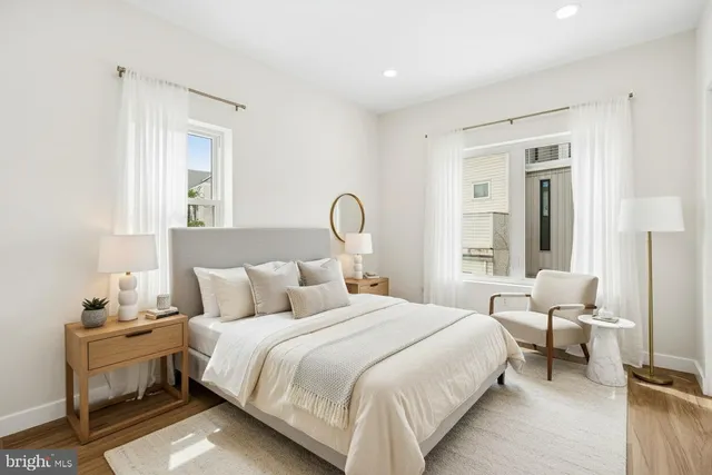 a bedroom with bed and a window