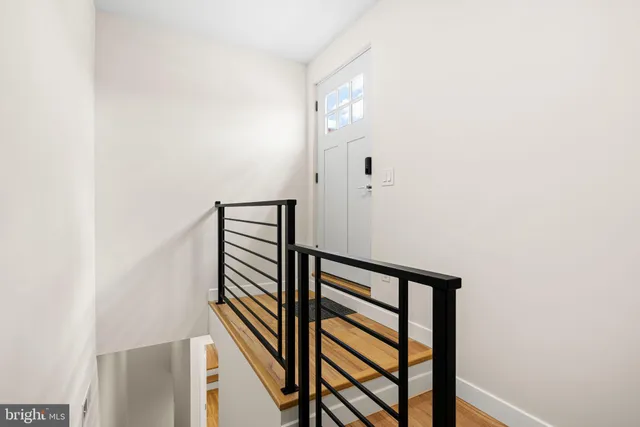a view of a hallway with seating area