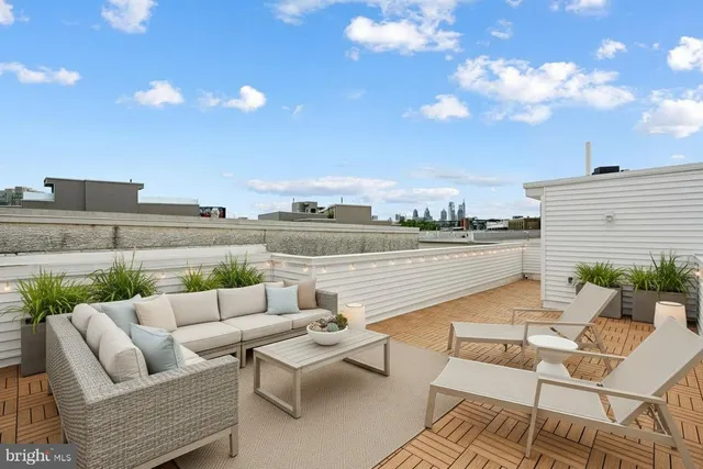 a balcony with furniture and city view