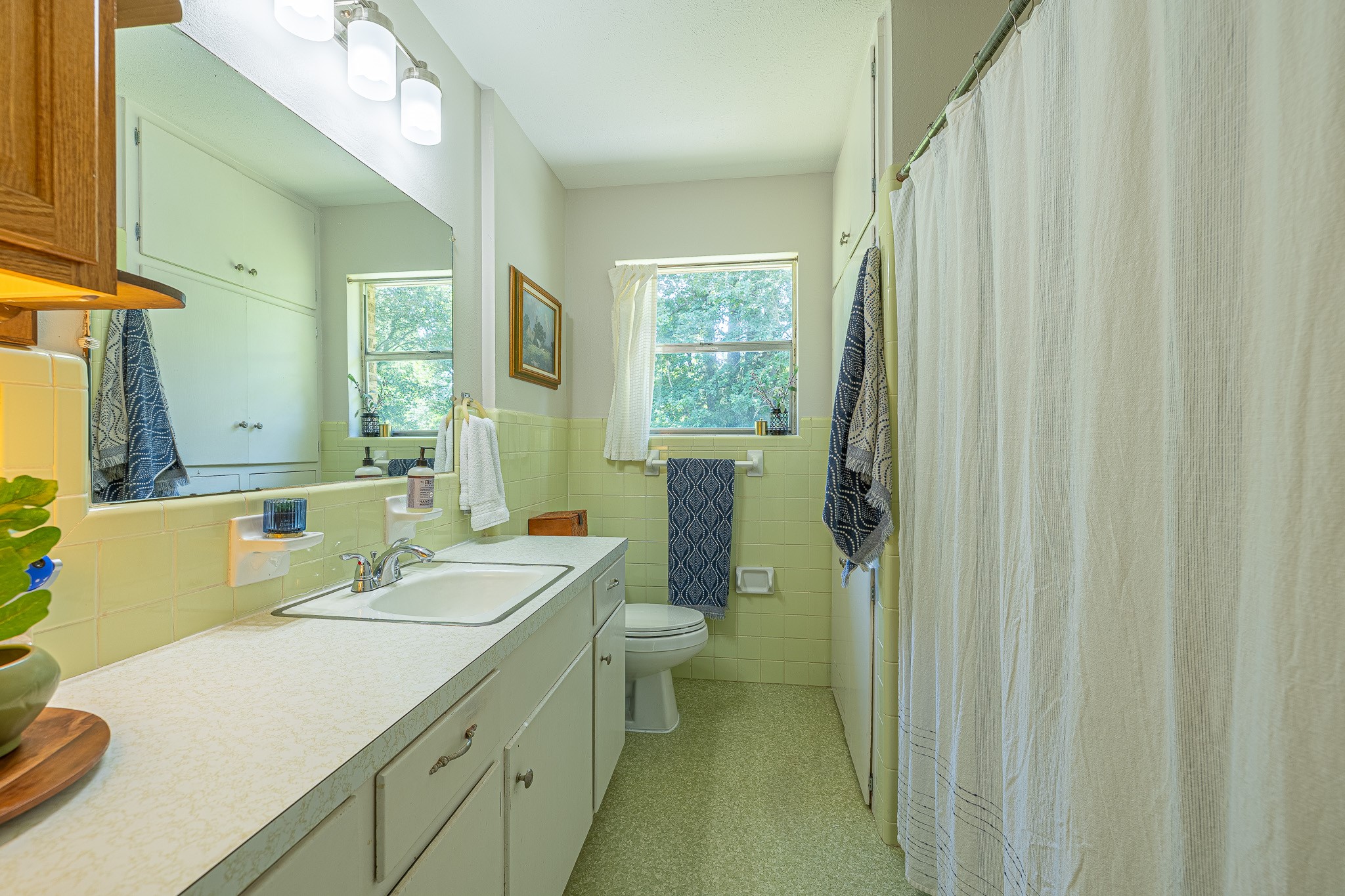 1009 Fish Hatchery Road Huntsville, TX 77320 - Photo 15 of 16 a bathroom with a sink a toilet and shower