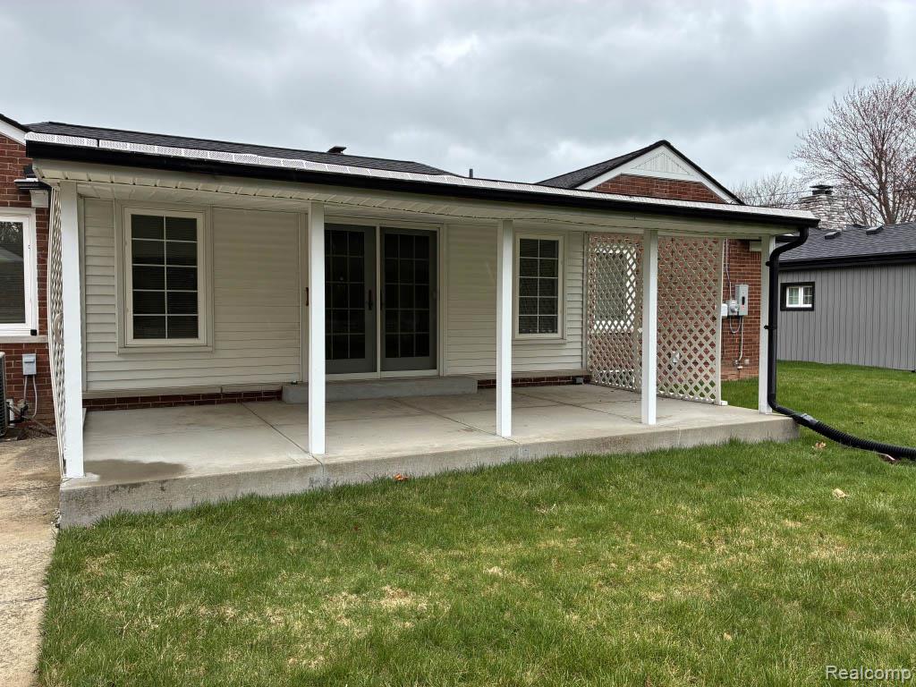 65 Hampton Road Grosse Pointe, MI 48236 - Photo 20 of 21 Outdoor oasis: covered, raised slab patio with a permanent gas BBQ-perfect for shaded entertaining.