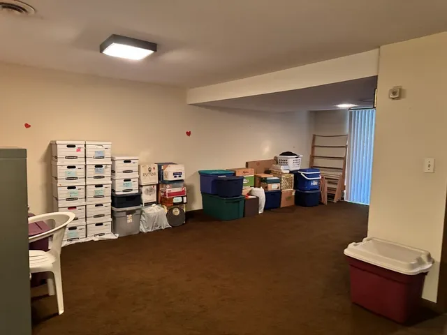 a view of a livingroom with space furniture and windows