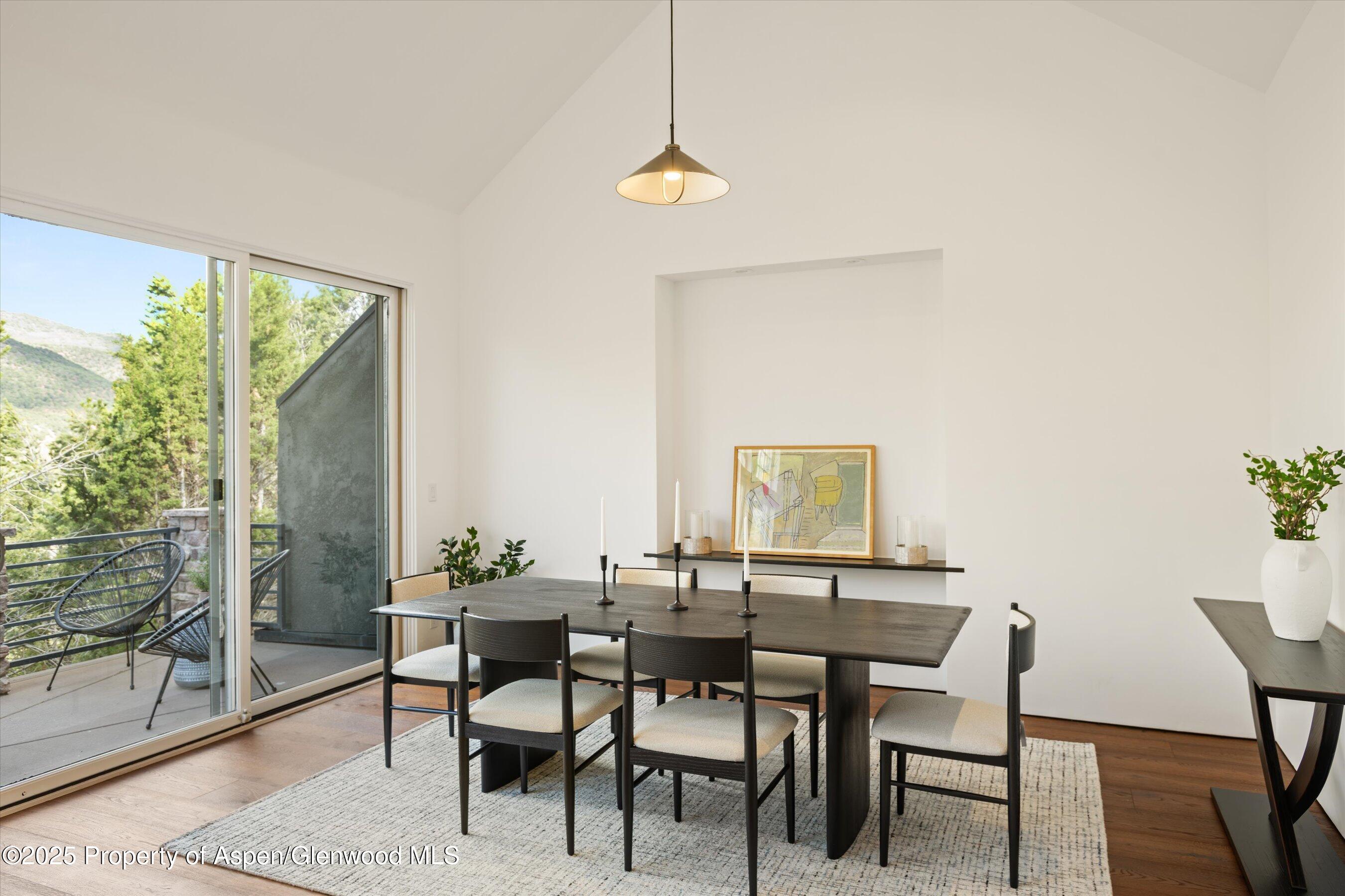 302 Wild Spring Lane Basalt, CO 81621 - Photo 9 of 28 a view of a dining room with furniture and wooden floor