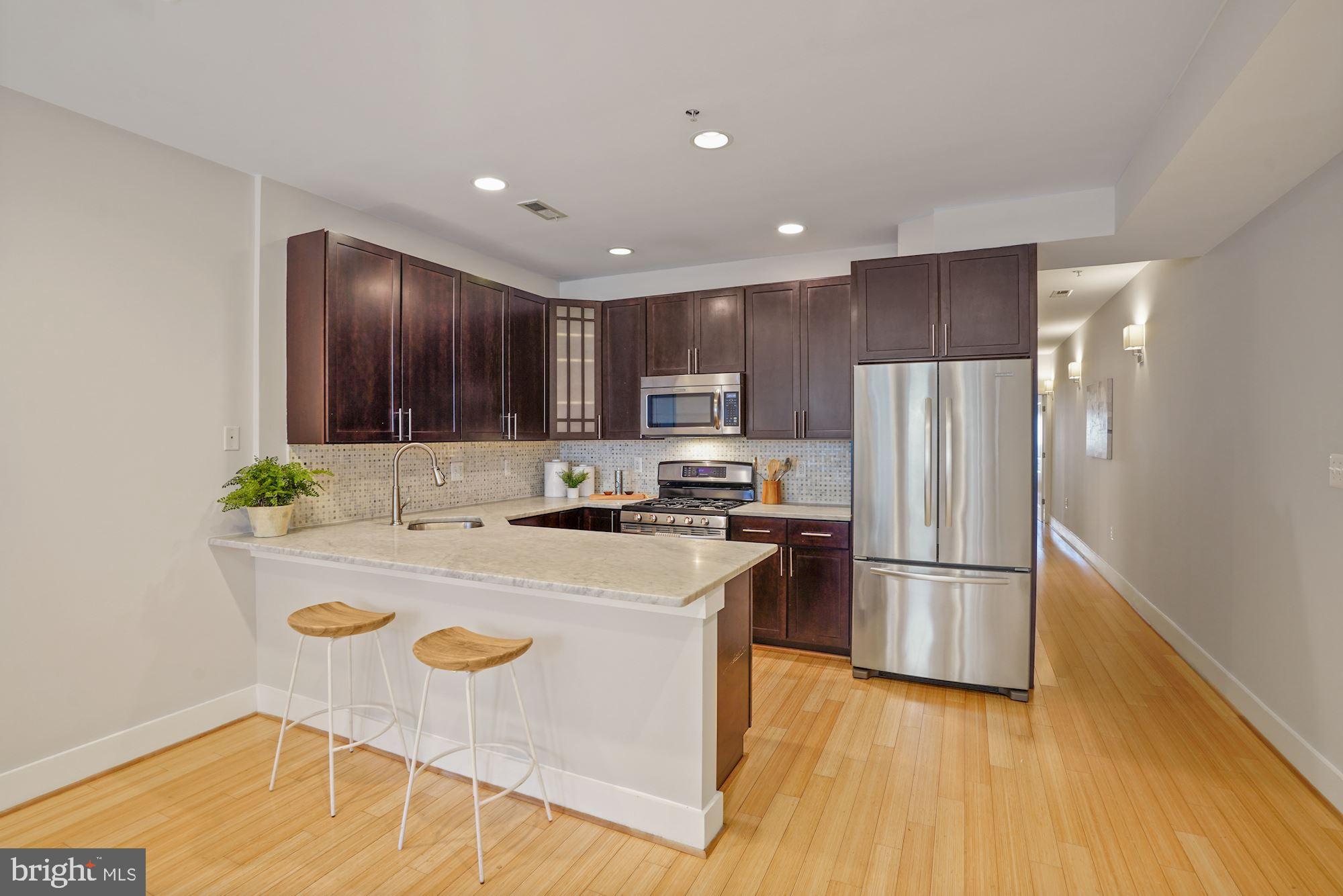 3546 13th Street Northwest, Unit 1 Washington, DC 20010 - Photo 5 of 18 Casual breakfast bar with marble countertop