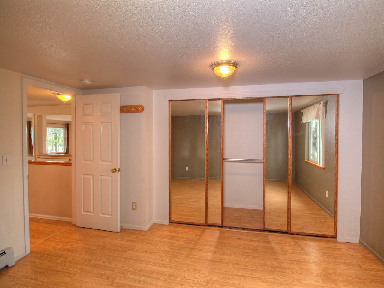 1754 L L 1/2 Road Fruita, CO 81521 - Photo 16 of 22 a view of empty room with wooden floor