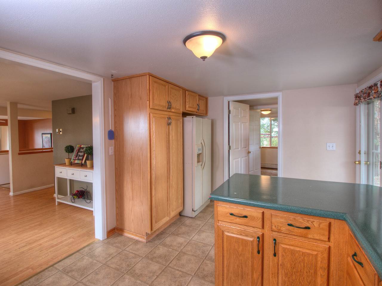 1754 L L 1/2 Road Fruita, CO 81521 - Photo 8 of 22 a kitchen with stainless steel appliances granite countertop a refrigerator and a sink