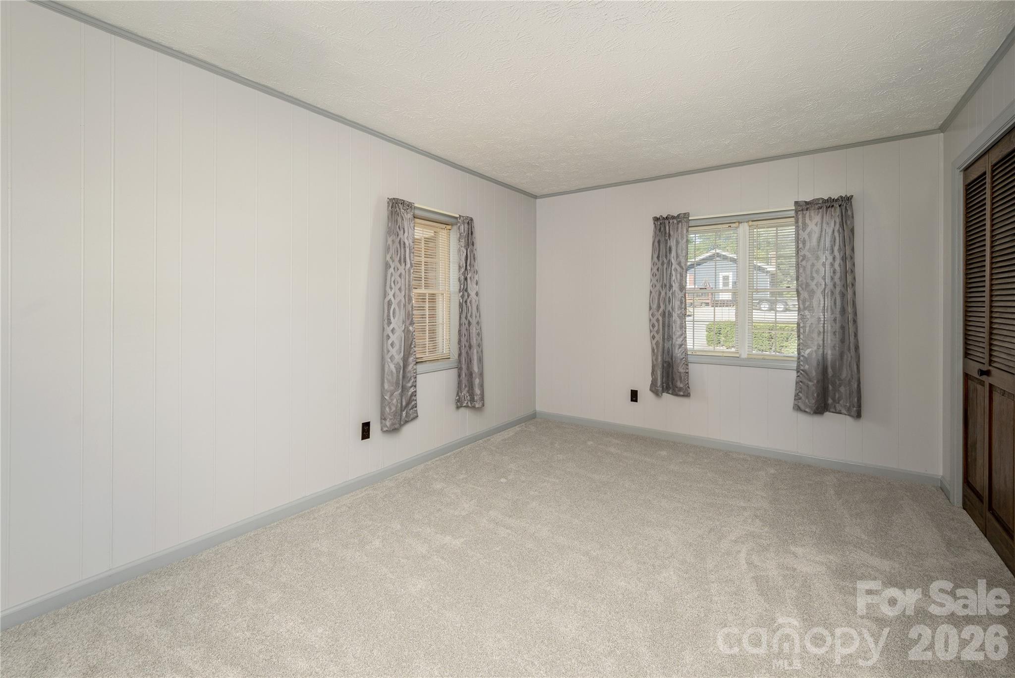 231 Allen Road East Flat Rock, NC 28726 - Photo 23 of 42 an empty room with windows