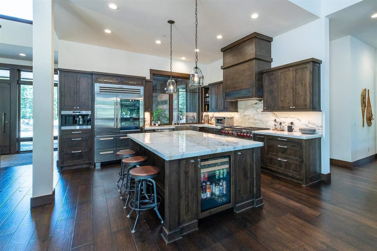 10617 Carson Range Road Truckee, CA 96161 - Photo 6 of 21 a kitchen with stainless steel appliances granite countertop a stove a refrigerator and a wooden cabinets