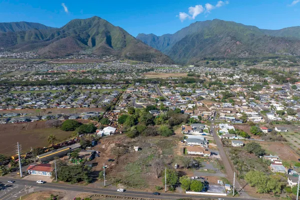an aerial view of residential house and sandy dunes
