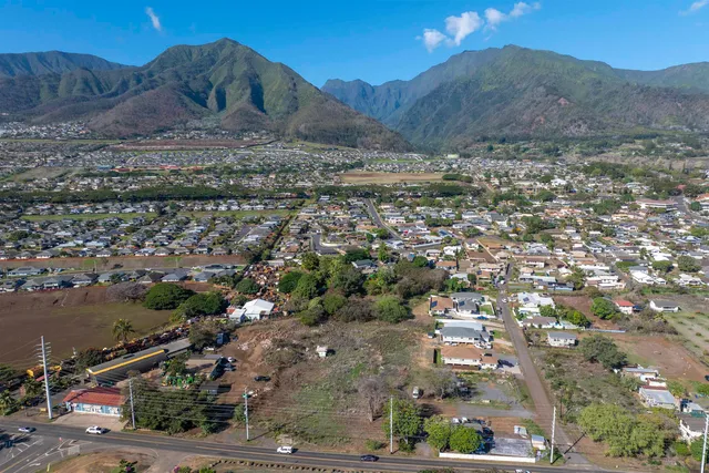 an aerial view of residential house and sandy dunes