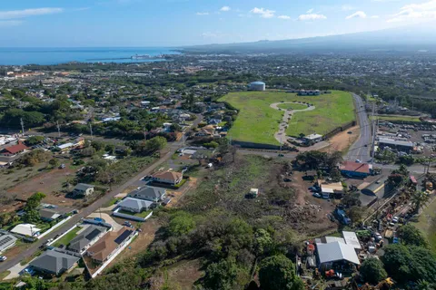 an aerial view of a house with a swimming pool