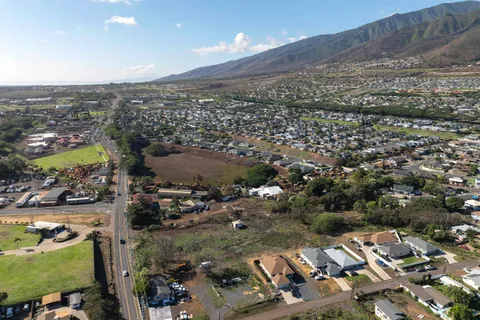 an aerial view of residential houses with outdoor space