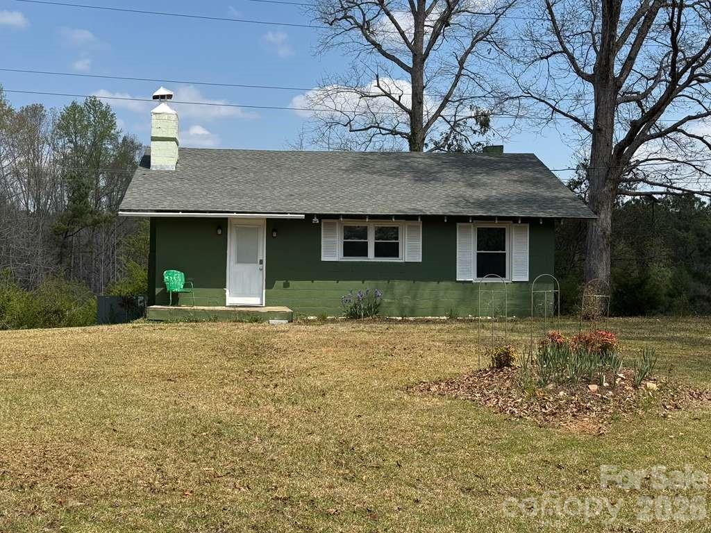 341 Lake Road Rockingham, NC 28379 - Photo 1 of 25 a front view of a house with garden