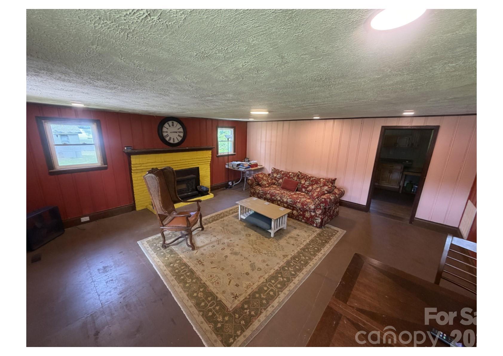 341 Lake Road Rockingham, NC 28379 - Photo 13 of 25 a living room with furniture and a flat screen tv