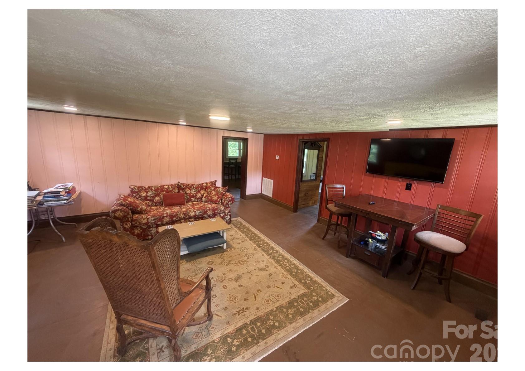 341 Lake Road Rockingham, NC 28379 - Photo 14 of 25 a living room with furniture and a flat screen tv