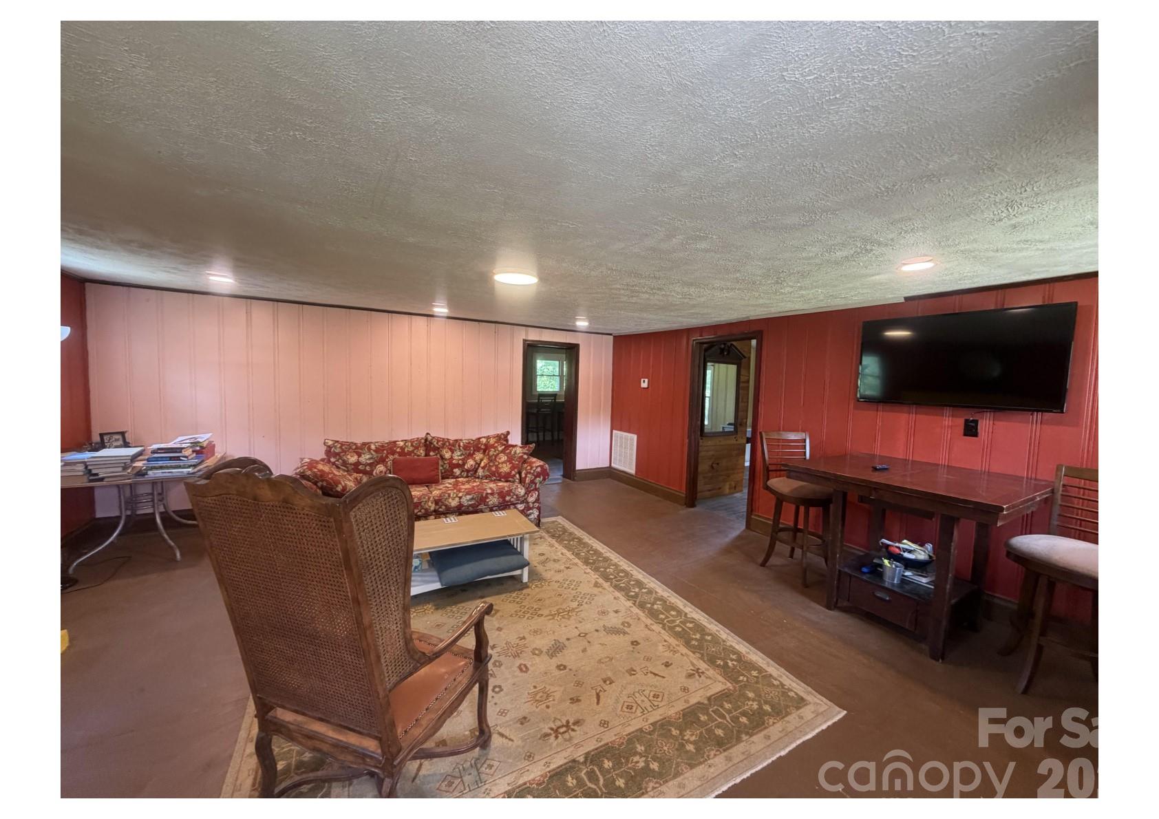 341 Lake Road Rockingham, NC 28379 - Photo 15 of 25 a living room with furniture and a flat screen tv