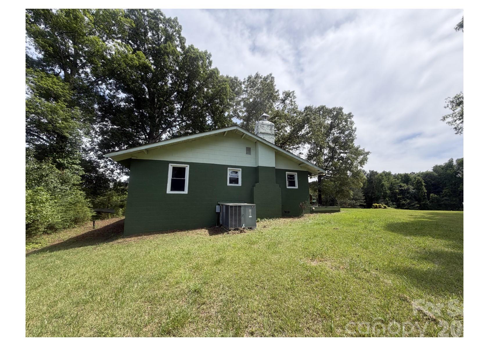 341 Lake Road Rockingham, NC 28379 - Photo 16 of 25 a backyard of a house with lots of green space