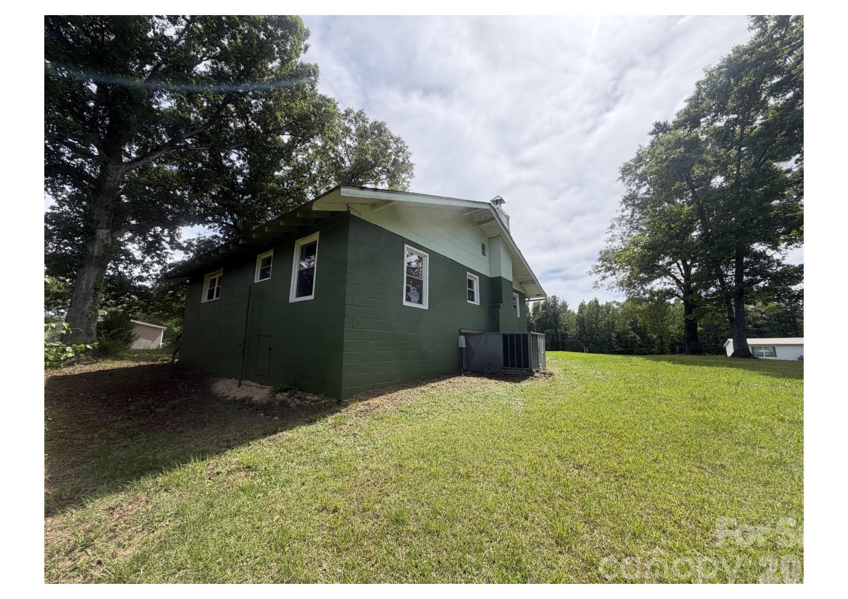 341 Lake Road Rockingham, NC 28379 - Photo 17 of 25 a backyard of a house with lots of green space