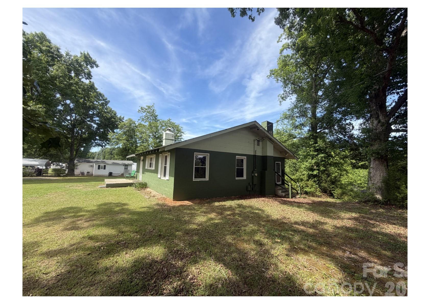 341 Lake Road Rockingham, NC 28379 - Photo 20 of 25 a front view of house with yard and trees