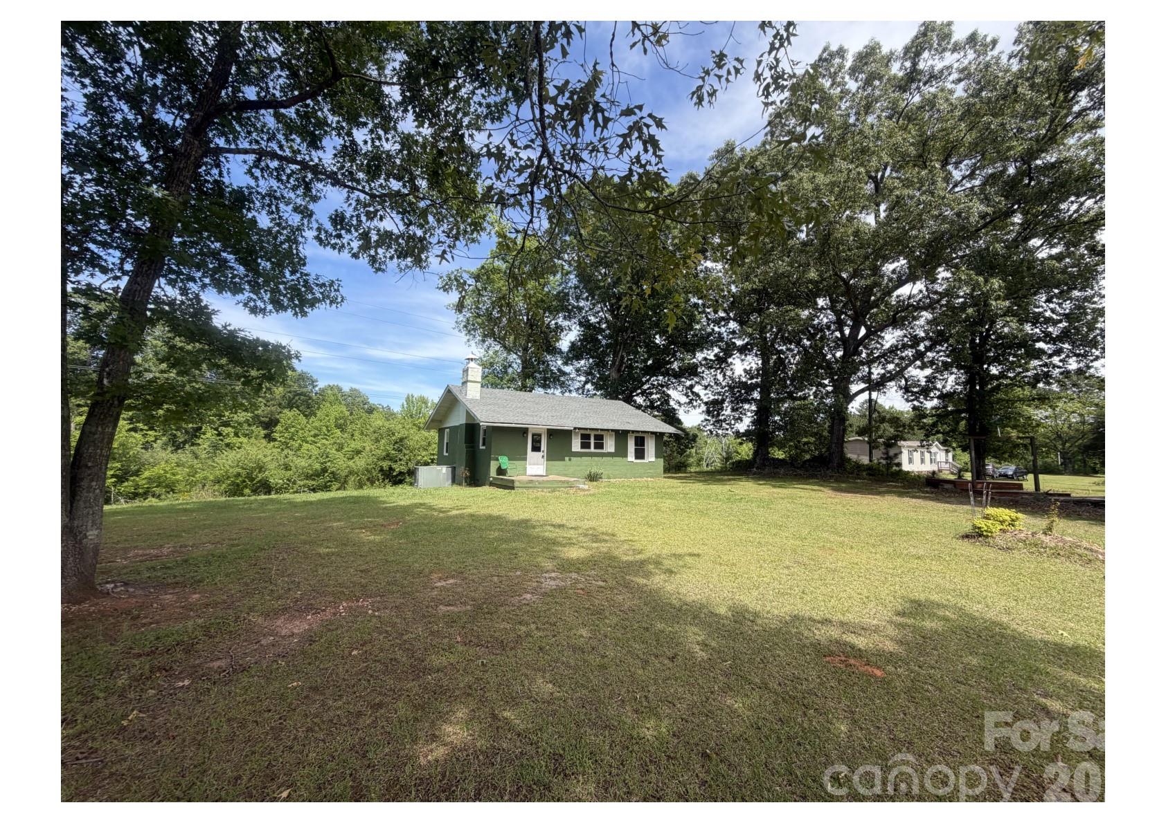 341 Lake Road Rockingham, NC 28379 - Photo 24 of 25 a front view of a house with a garden