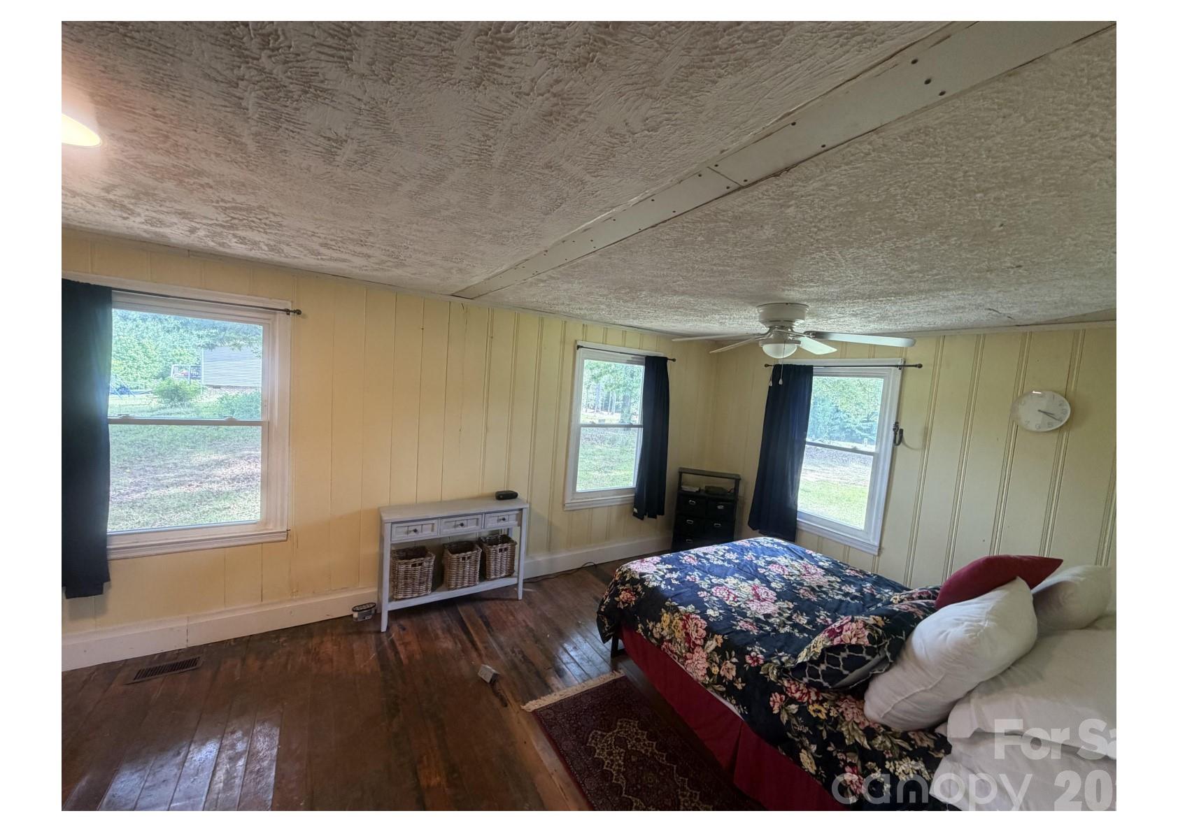 341 Lake Road Rockingham, NC 28379 - Photo 3 of 25 a bedroom with a bed and a large window