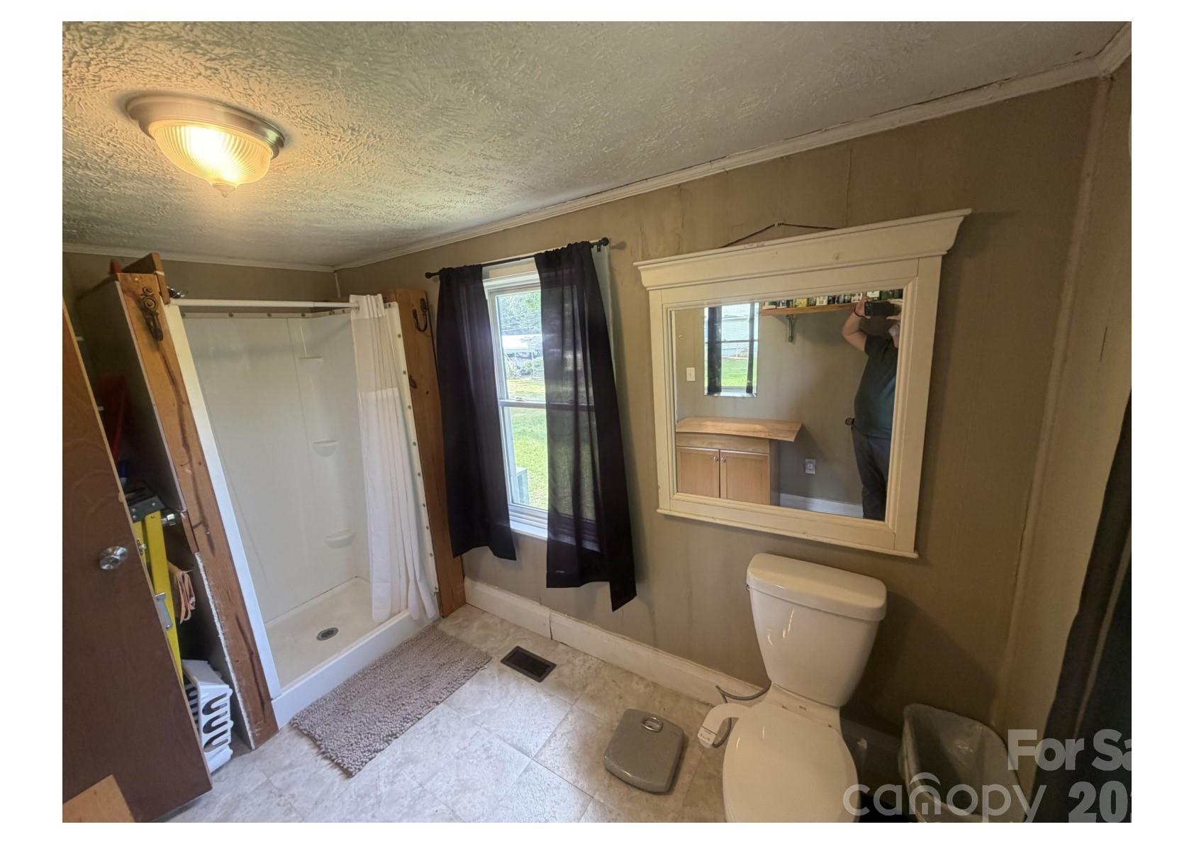 341 Lake Road Rockingham, NC 28379 - Photo 7 of 25 a bathroom with a sink and a mirror