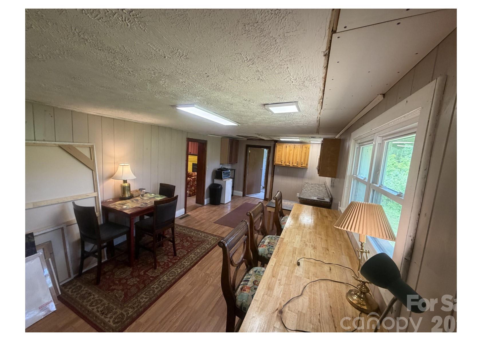 341 Lake Road Rockingham, NC 28379 - Photo 8 of 25 a view of a dining room with furniture window and outside view