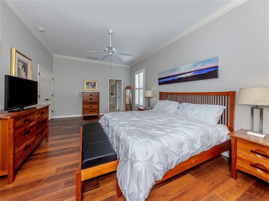 406 Trenwick Lane Venice, FL 34293 - Photo 18 of 60 a bedroom with bed and flat screen tv