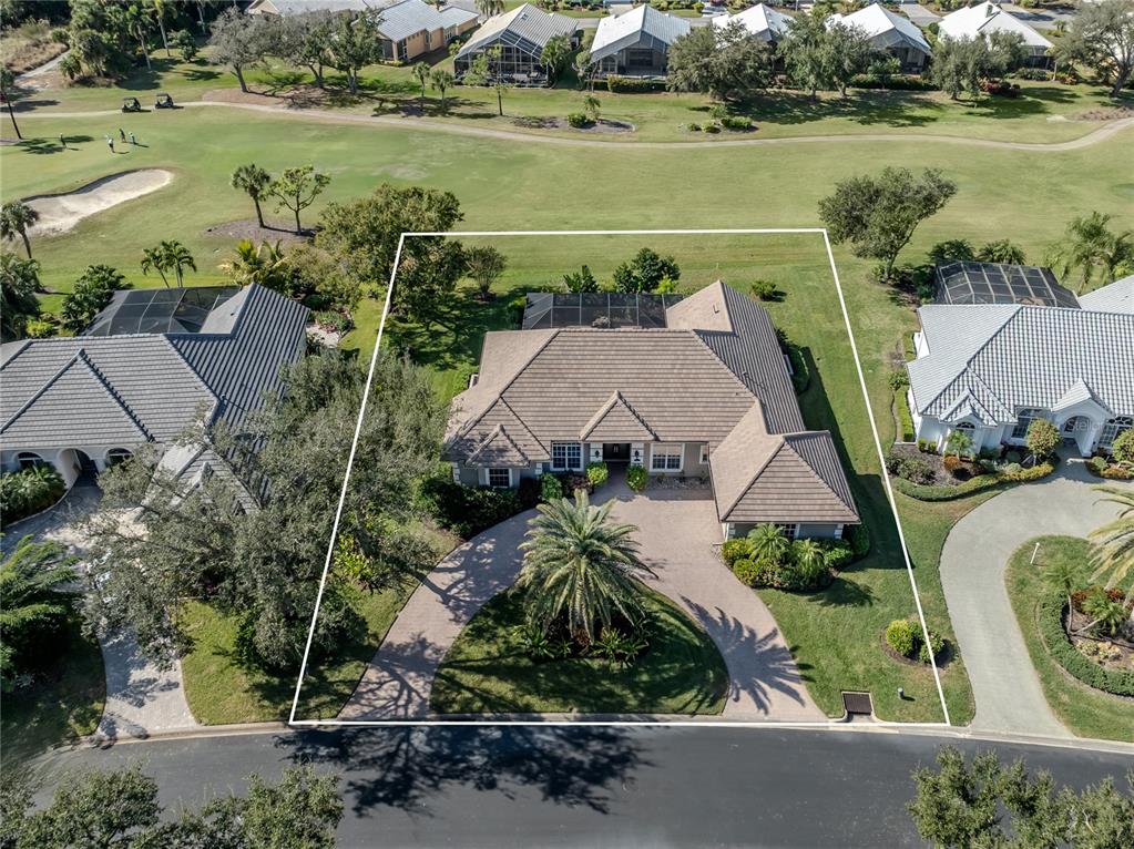 406 Trenwick Lane Venice, FL 34293 - Photo 3 of 60 an aerial view of a house with a lake view
