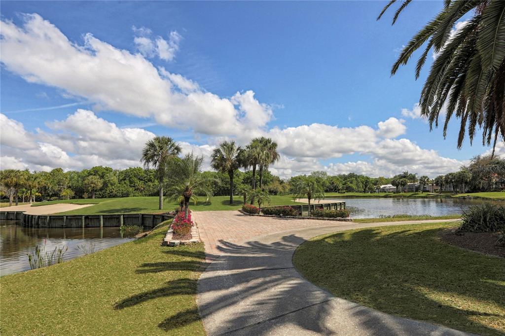 406 Trenwick Lane Venice, FL 34293 - Photo 47 of 60 a view of a lake with a house in the background