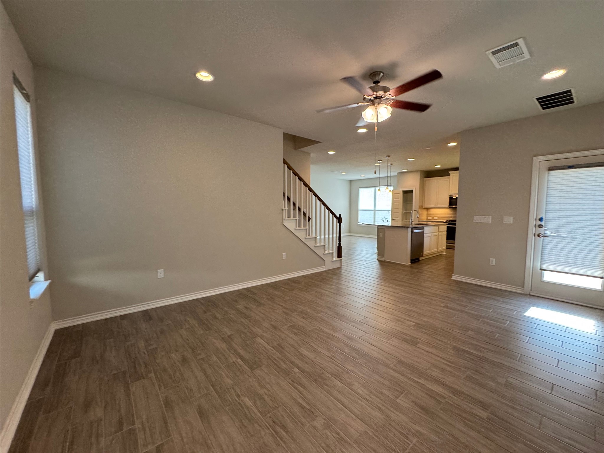 14100 McCoy Loop, Unit 1 Austin, TX 78717 - Photo 12 of 39 An inviting open-concept layout connects the living area with a contemporary kitchen, perfect for everyday living.