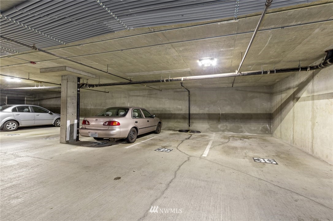 108 5th Avenue South, Unit 710 Seattle, WA 98104 - Photo 16 of 22 a view of parking garage with cars parked